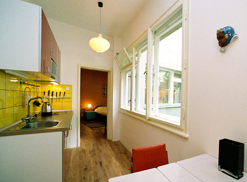 
Kitchen and bedroom of Benediktska 2 holiday rental apartment in Prague. Apartments in Prague specializes in short-term rental apartments to tourists interested in visiting Prague.