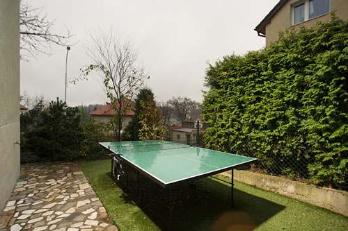 On a sunny summer day you can play tennis outdoors - or challenge the home owner who lives downstairs.