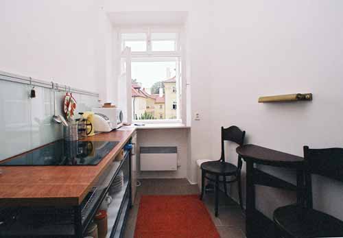 
Kitchen in Kampa apartment, an apartment in Prague, and the view of the Charles Bridge from the window. Kampa, an apartment offered by Apartments in Prague, is close to Prague’s Charles Bridge and Malostranske Namesti.