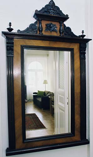 
Antique mirror in Spanelska apartment. Spanelska, an apartment offered by Prague Accommodations, is near to Prague’s Wenceslas Square and the main train station.