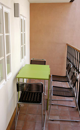 
Balcony, table and chairs looking into the courtyard  in Janska 7 apartment 5 offered by Apartaments in Prag.  Prague Hotel apartment accommodation is offered  by accommodation in Prague and apartments in Prague. This short-term apartment rental Accomodations is close to Prague’s Charles Bridge and Malostranske Namesti is in Mala Strana and is offered by apartments in Prague