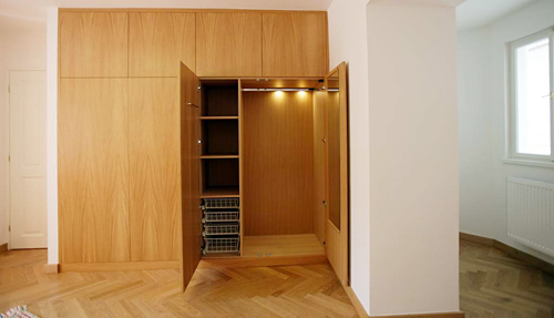 
Built-in closets in the orange living room in Janska 7 apartment 5 offered by Apartaments in Prag.  Prague Hotel apartment accommodation is offered  by accommodation in Prague and apartments in Prague. This short-term apartment rental Accomodation is close to Prague’s Charles Bridge and Malostranske Namesti is in Mala Strana and is offered by apartments in Prague
