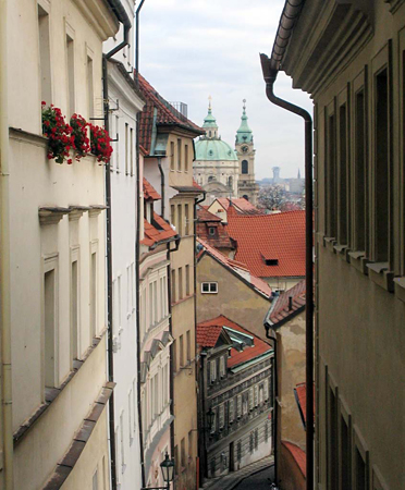 Janska Street and St. Nicholas Cathedral from the window of Apt. 4 in Residence Janska, an appartament offered by Apartments in Prague, a Prague Hotel apartment accommodation offered  by accommodations in Prague. This short-term apartment rental Accomodation is close to Prague’s Charles Bridge and Malostranske Namesti is in Mala Strana.